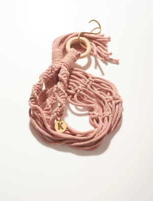 Modern, eco friendly macramé Plant Hanger in Plaster Pink, Twisted knot style. Handmade from 100% recycled cotton, with a free brass hanging hook and beautiful eco-friendly gift box. Perfect gift for plant lovers.