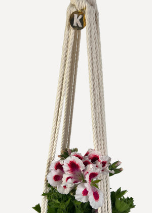 Cream Outdoor Plant Hanger handmade from 100% cotton and treated with eco-friendly waterproof spray, shown here with a Pelargonium