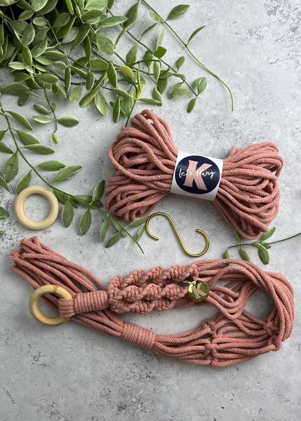 Make your own Macramé Plant Hanger kit in Plaster Pink, with brass S hook, engraved brass Knotted tag and wooden macramé ring.