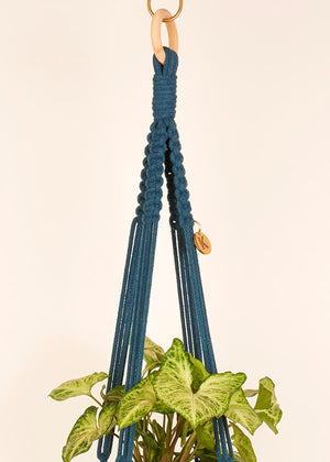 Close up of Peacock Blue macramé Plant Hanger, handmade from 100% recycled cotton