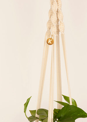 Close up of Twisted knot style in Vanilla macramé Plant Hanger, handmade from 100% recycled cotton